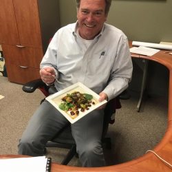 Principal Bob O Connor eats salad